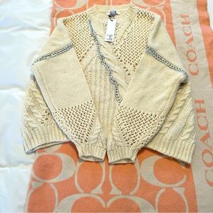 BB Dakota knit sweater with chain link throughout.